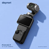 Daynori Pocket 4K vlog camera photographed diagonally on a blue surface.