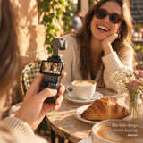 Daynori Pocket lifestyle illustration showing a friend being filmed at a sunny cafe.